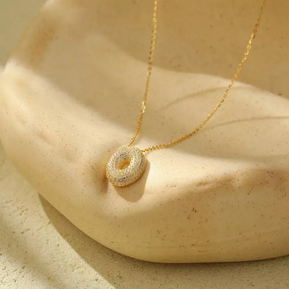 Stainless steel initial pendant necklace with zircon accents, personalized with your choice of letter.