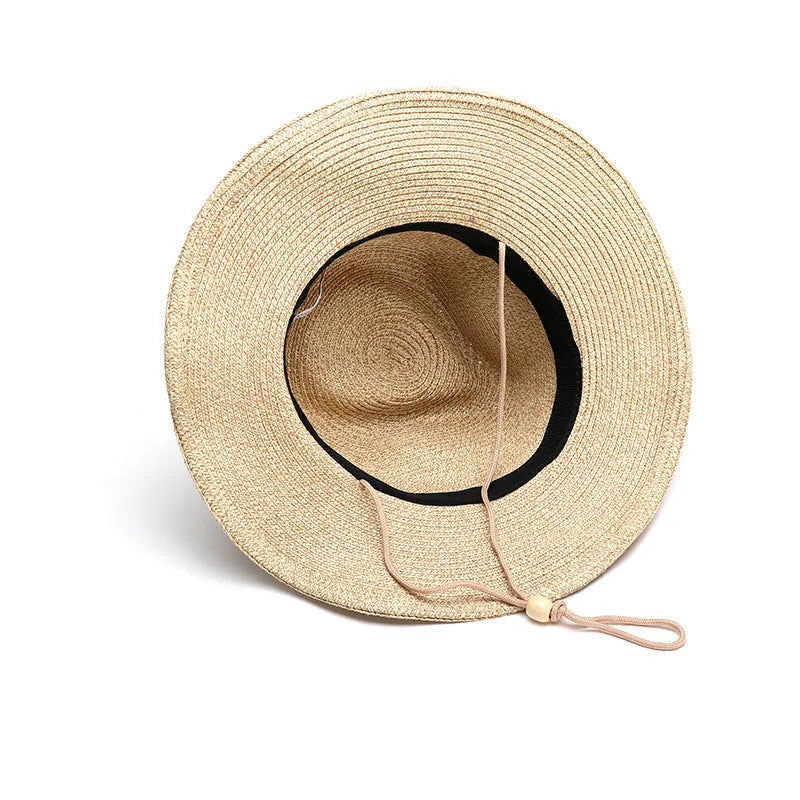 Man's foldable natural straw sun hat with a wide brim shown in mixed beige colour.