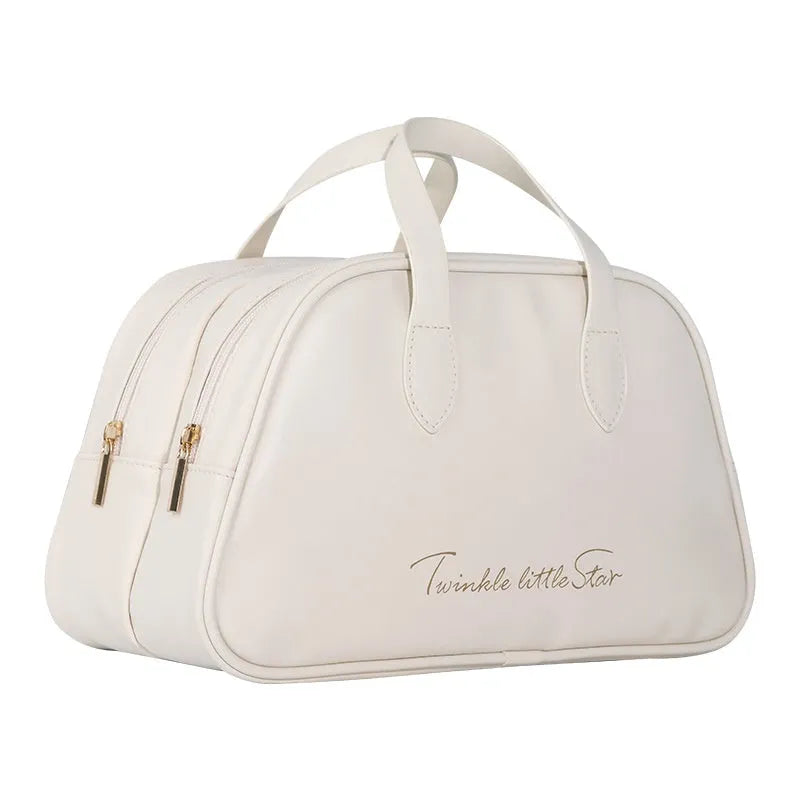 Leather travel toiletry bag with dry-wet separation compartments in caramel mocha colour with letter detailing