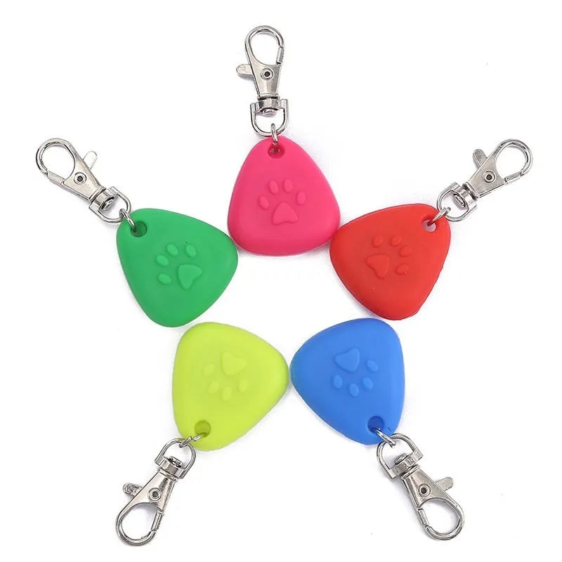 Silicone triangle-shaped light-up pendant pet ornament in one of five colours: red, pink, blue, green, or yellow.