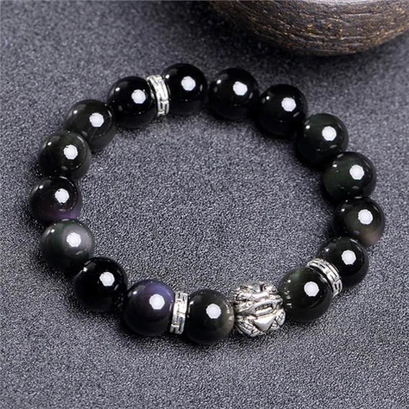 Silver 999 natural obsidian bracelet with cloud year design, shown in 10mm and 12mm unisex sizes.