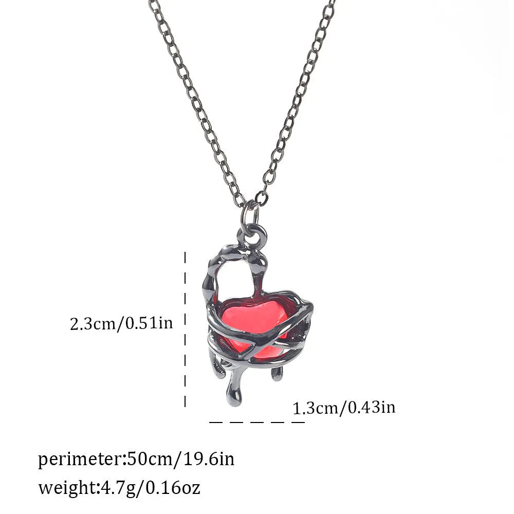 Gothic style zinc alloy necklace with bat pendant on a silver chain against dark background.