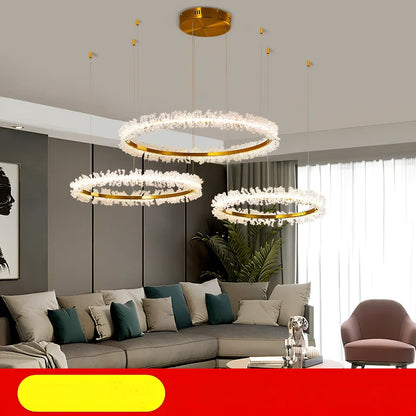 Gold electroplated crystal chandelier with remote control, adjustable height mechanism, and multiple LED lights