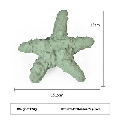 Blue rubber shark-shaped dog toy with food dispensing openings on a white background.