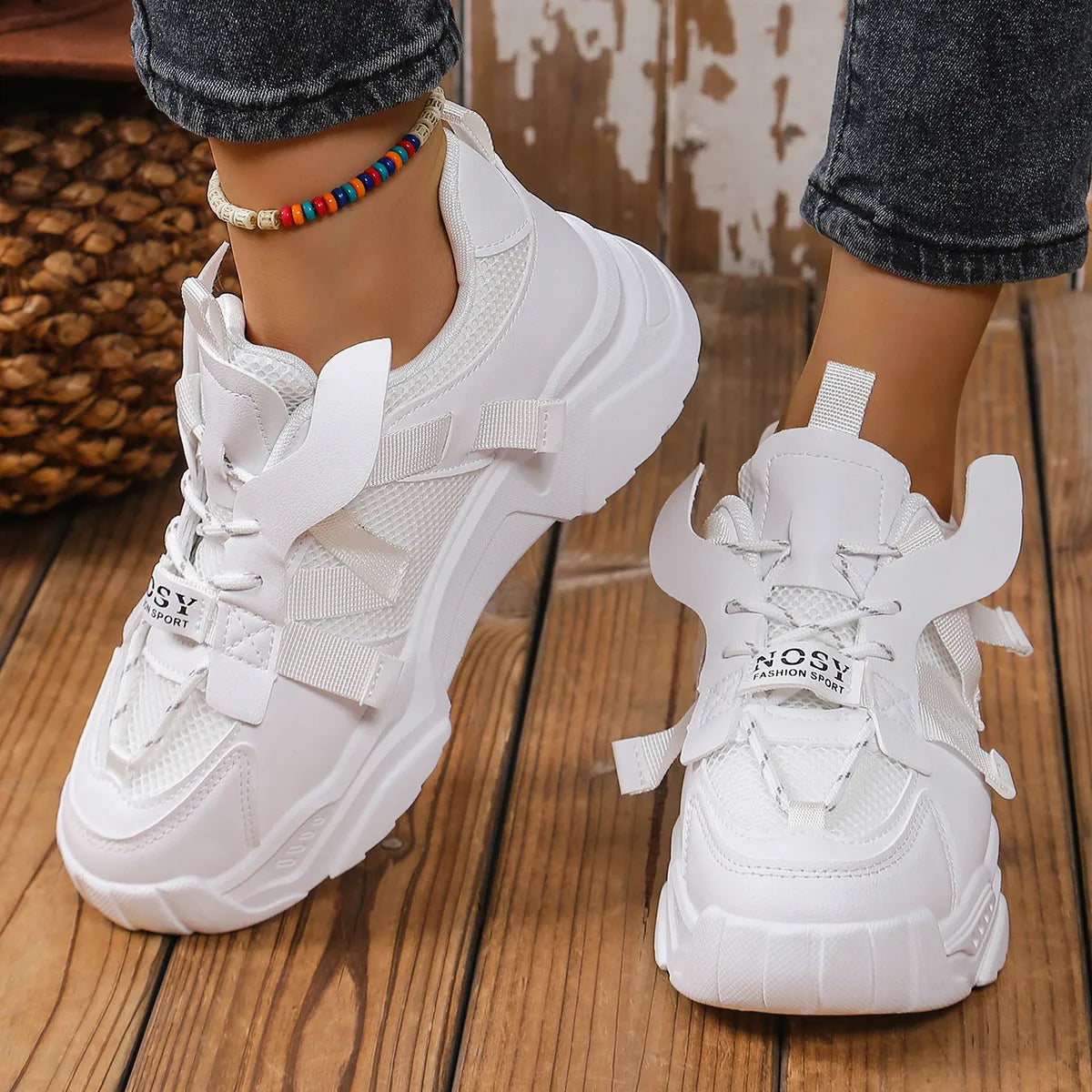 Women's platform sneakers in animal print with breathable mesh upper and front lace-up design.