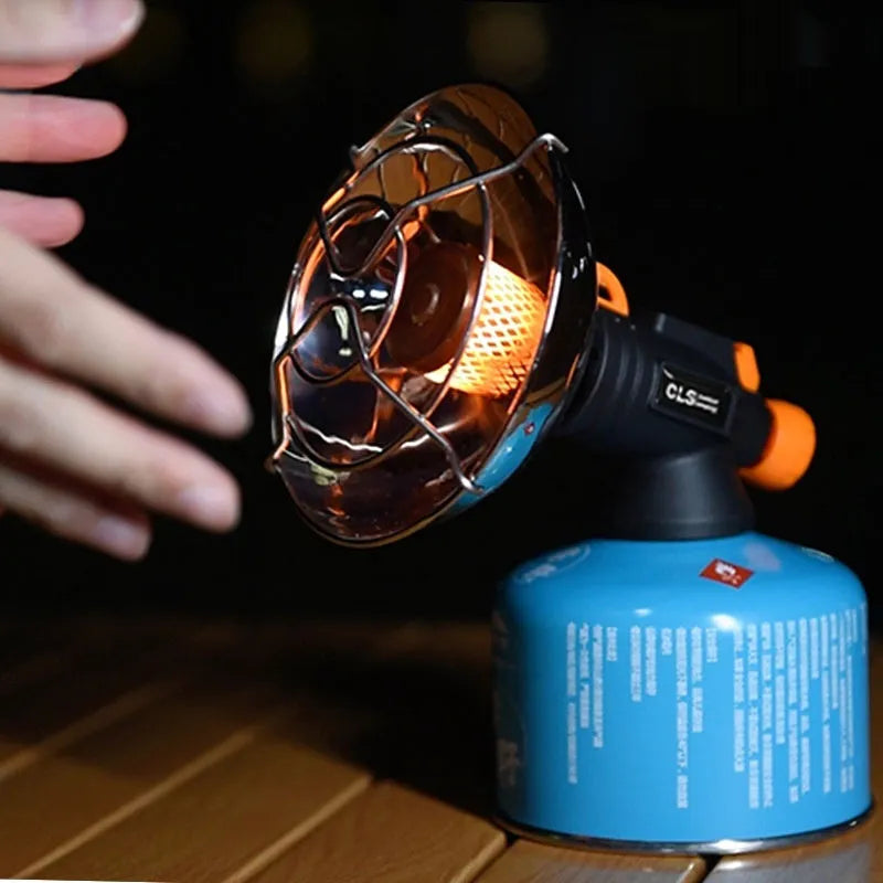 Black and orange portable outdoor heating stove with automatic press ignition for camping, weighing 215g