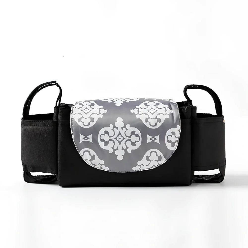 Baby stroller organiser with cup holder mounted on pram pole showing storage compartments