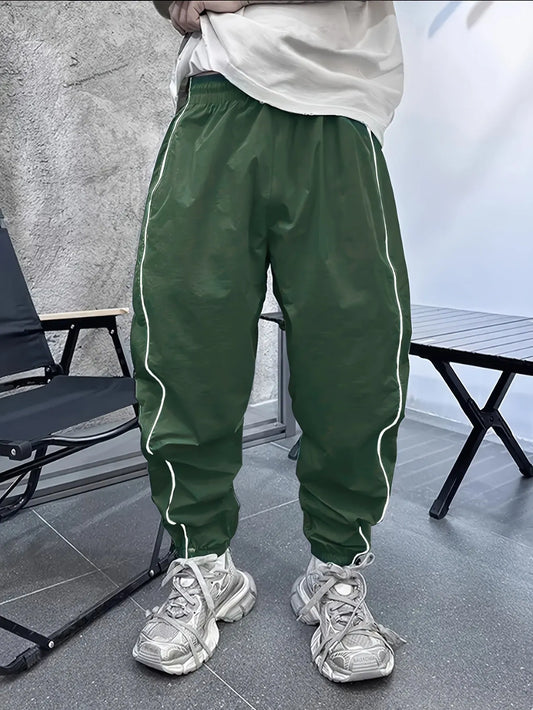 Men's bamboo fibre cropped sports trousers in army green colour showing loose fit and elastic waistband