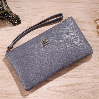 Long 55 cm PU leather wallet handbag in wine red colour with zipper closure open showing interior phone pocket and card slots