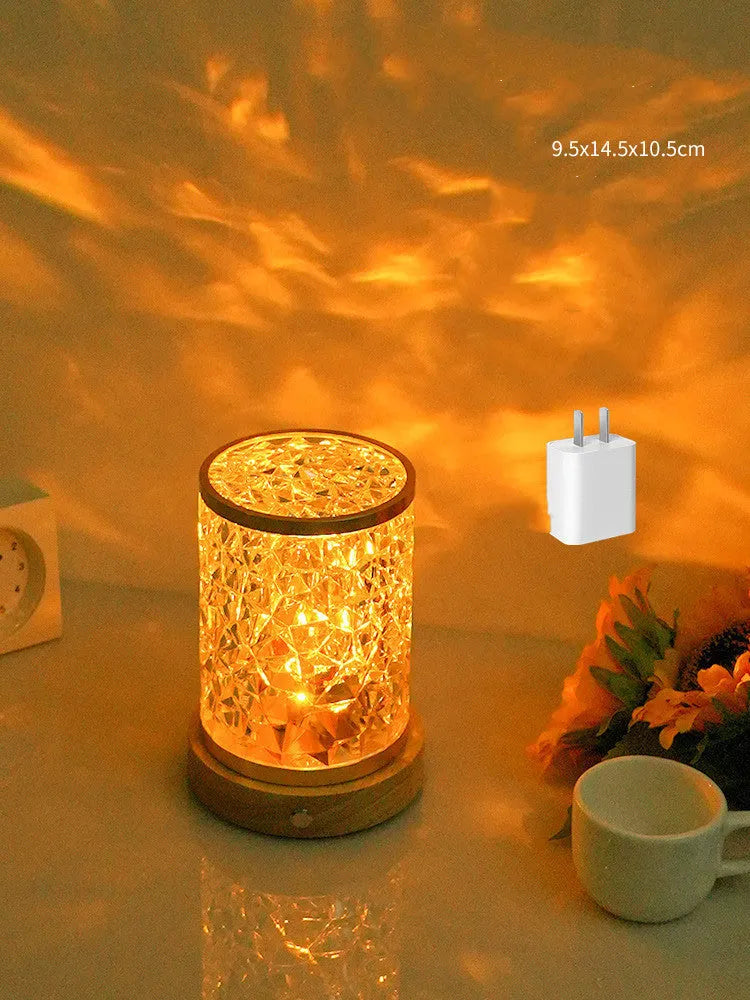 Rotating water ripple night light with acrylic construction and solid wood base measuring 9.5x14.5x10.5cm