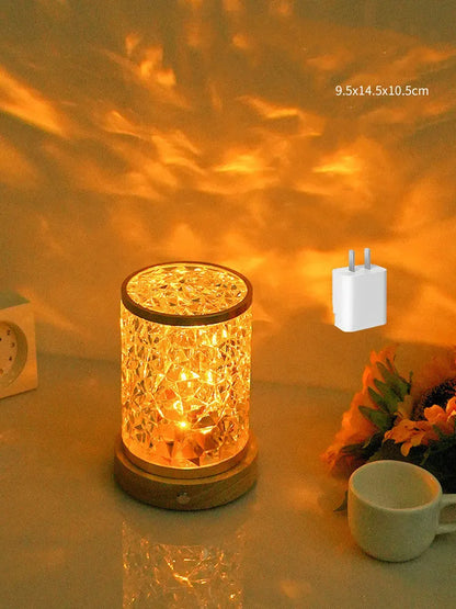 Rotating water ripple night light with acrylic construction and solid wood base measuring 9.5x14.5x10.5cm