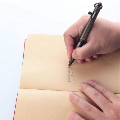 Brass tactical pen with hexagonal bolt design showing natural brass colour option