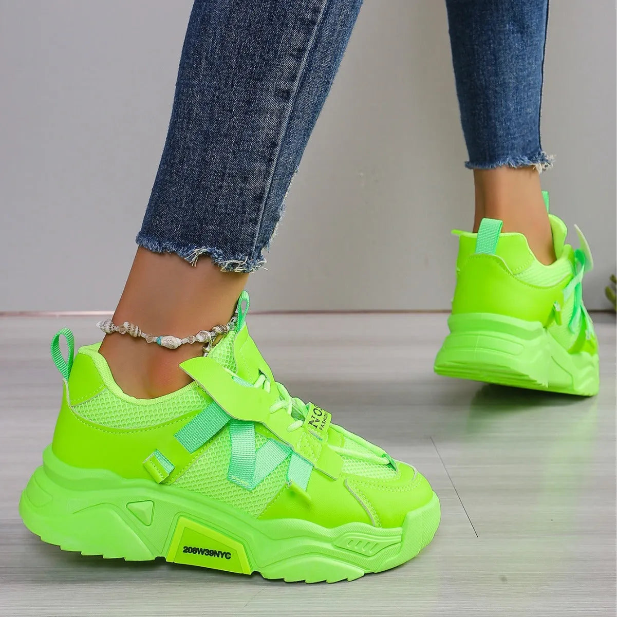 Women's platform sneakers in animal print with breathable mesh upper and front lace-up design.