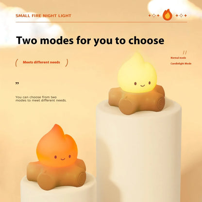 Small silicone fire pile-shaped night lamp with a cartoon ABS shade showing yellow light illumination.