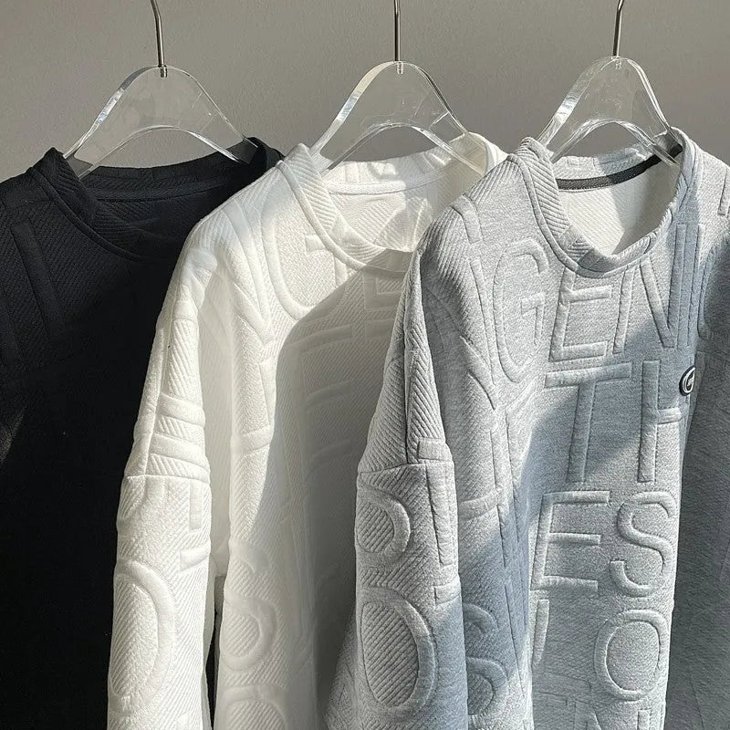 Grey men's loose T-shirt with a raised black three-dimensional retro letter design on the chest.