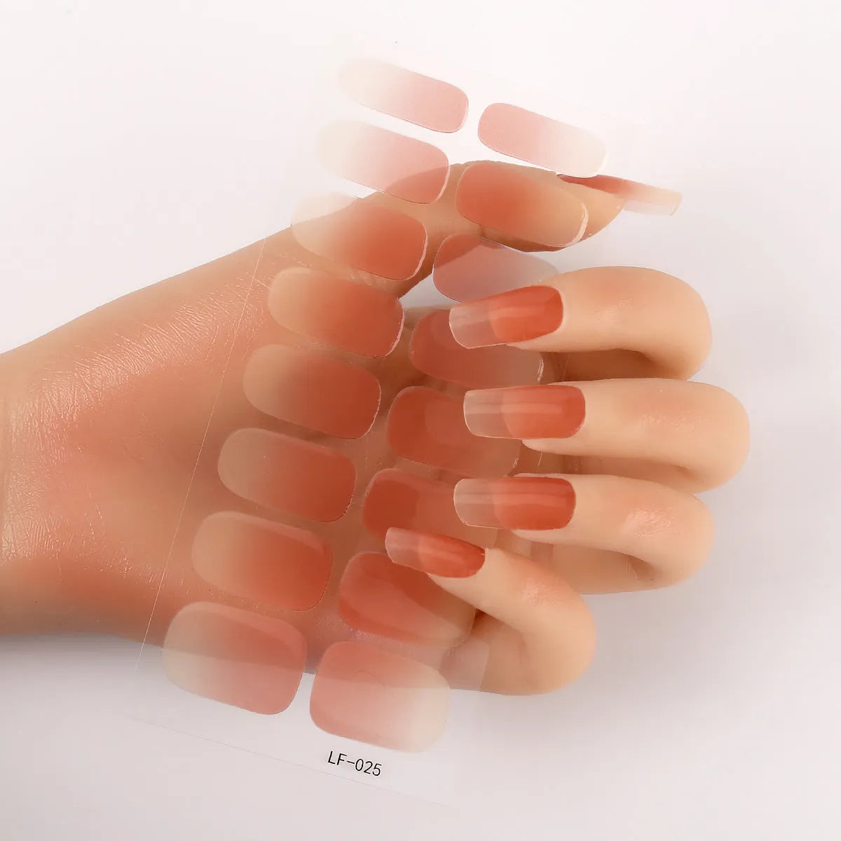 Sheet of 16 small design nail art stickers including cross, rose, tulip and marble patterns.