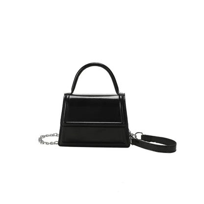 Retro style square PU leather crossbody bag in multiple colours on a model.