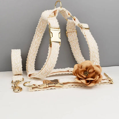White lace dog vest and matching collar with floral decoration for wedding or special occasion.