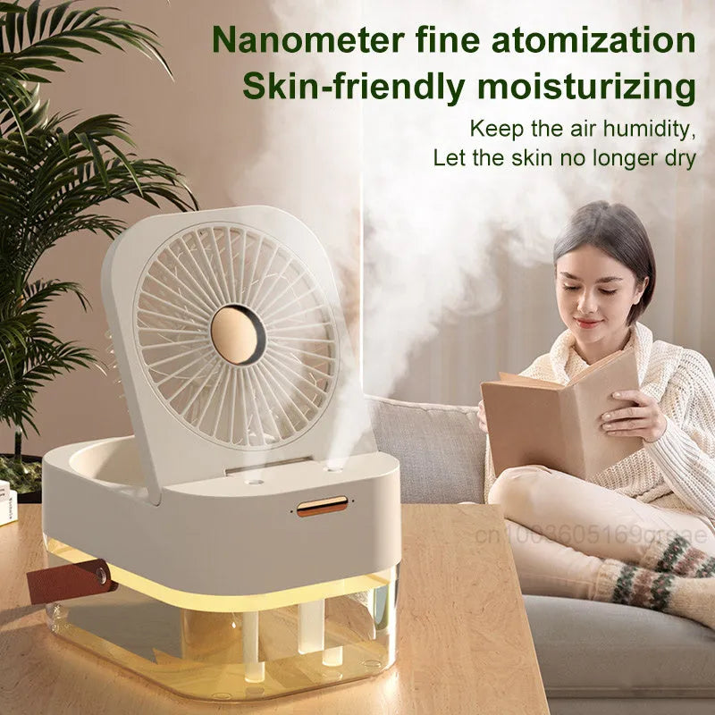 White or green USB desktop mist fan with large water tank, remote control, and dual spray nozzles on a desk.