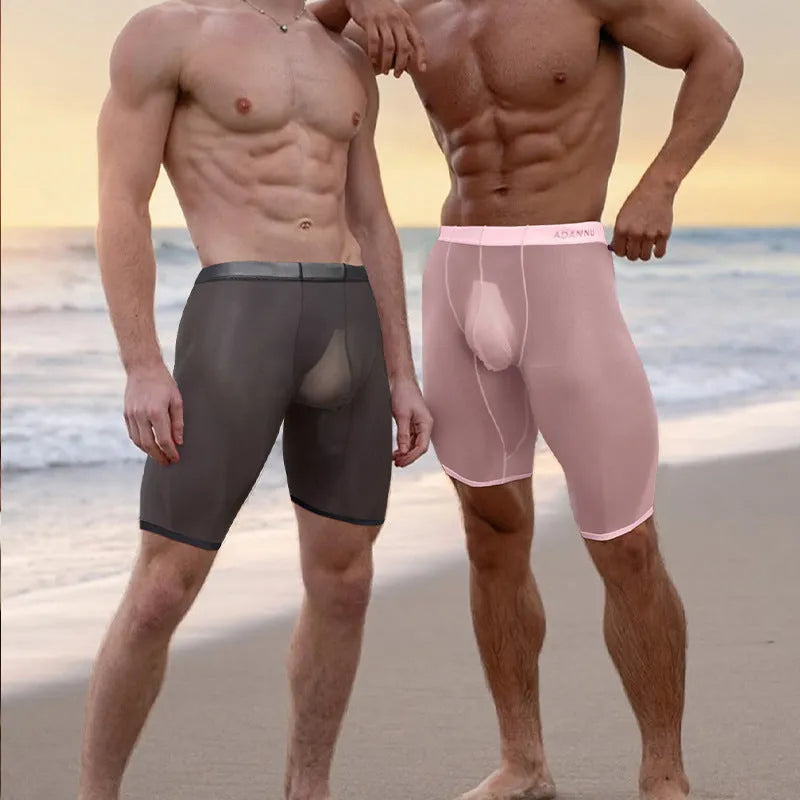 Fashion Personality men's black seamless mesh lounge shorts on a hanger, showing hip-lift design and knitted texture.