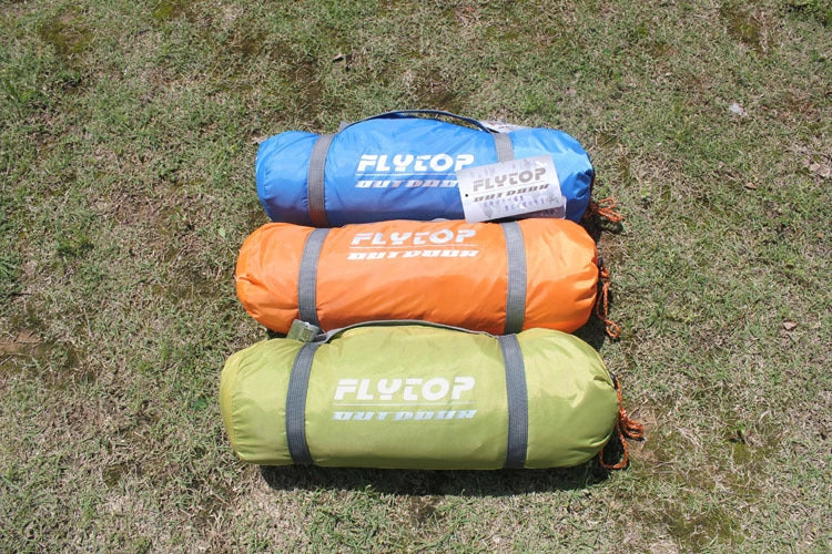 Double layer rainproof camping tent in green, orange, and blue colors for high altitude adventures