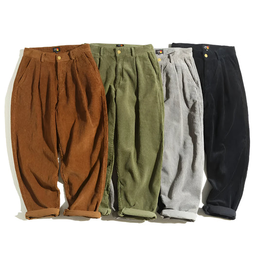 Men's straight-leg corduroy trousers in grey, shown laid flat, featuring a mid-rise waist and zip fly.