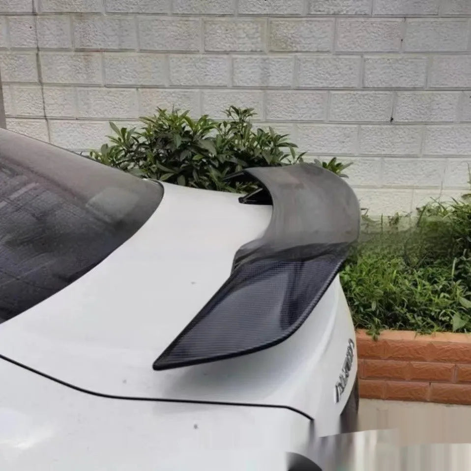 Car punch-free spoiler in ABS plastic showing adhesive mounting surface and finish options
