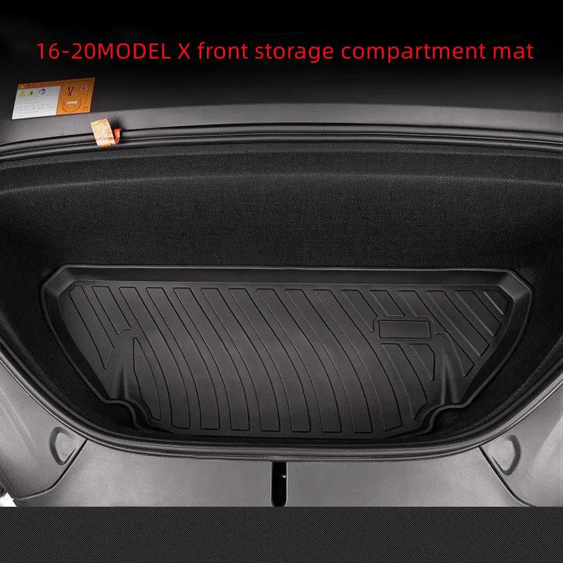Black TPE rubber floor mats for Tesla Model 3, showing deep grooves and raised edges on driver's side.