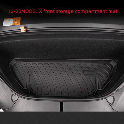 Black TPE rubber floor mats for Tesla Model 3, showing deep grooves and raised edges on driver's side.