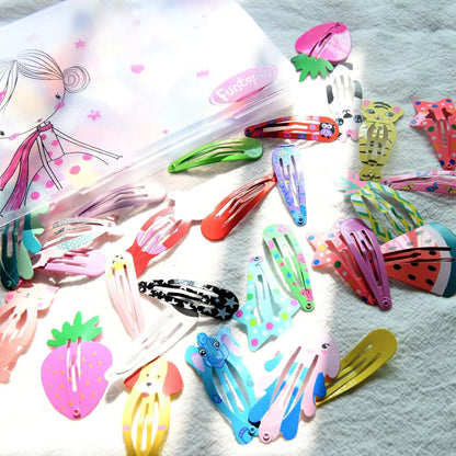 Assortment of 100 brightly coloured metal hair clips with cartoon designs of animals, fruits, crowns, stars, and drop shapes.