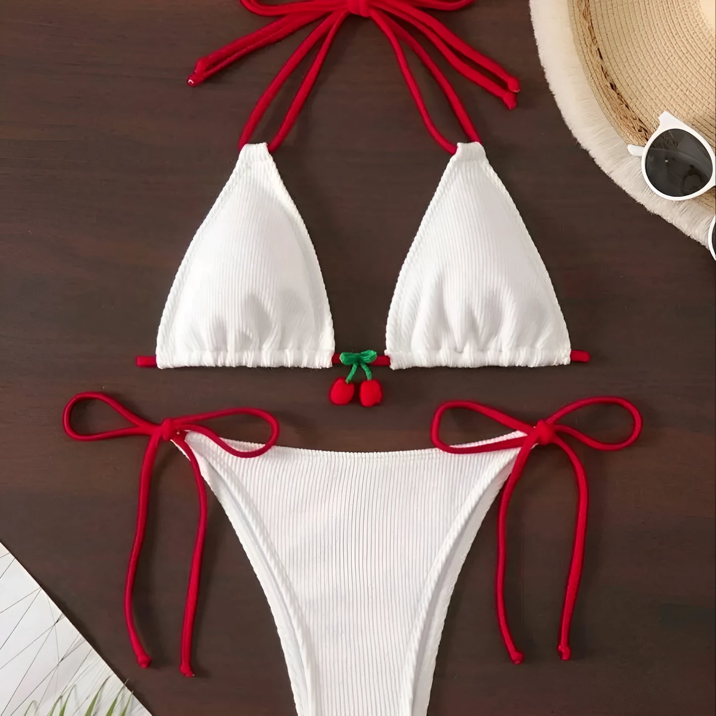 Solid colour briefs-style bikini swimsuit on a hanger, showing the top and pants.