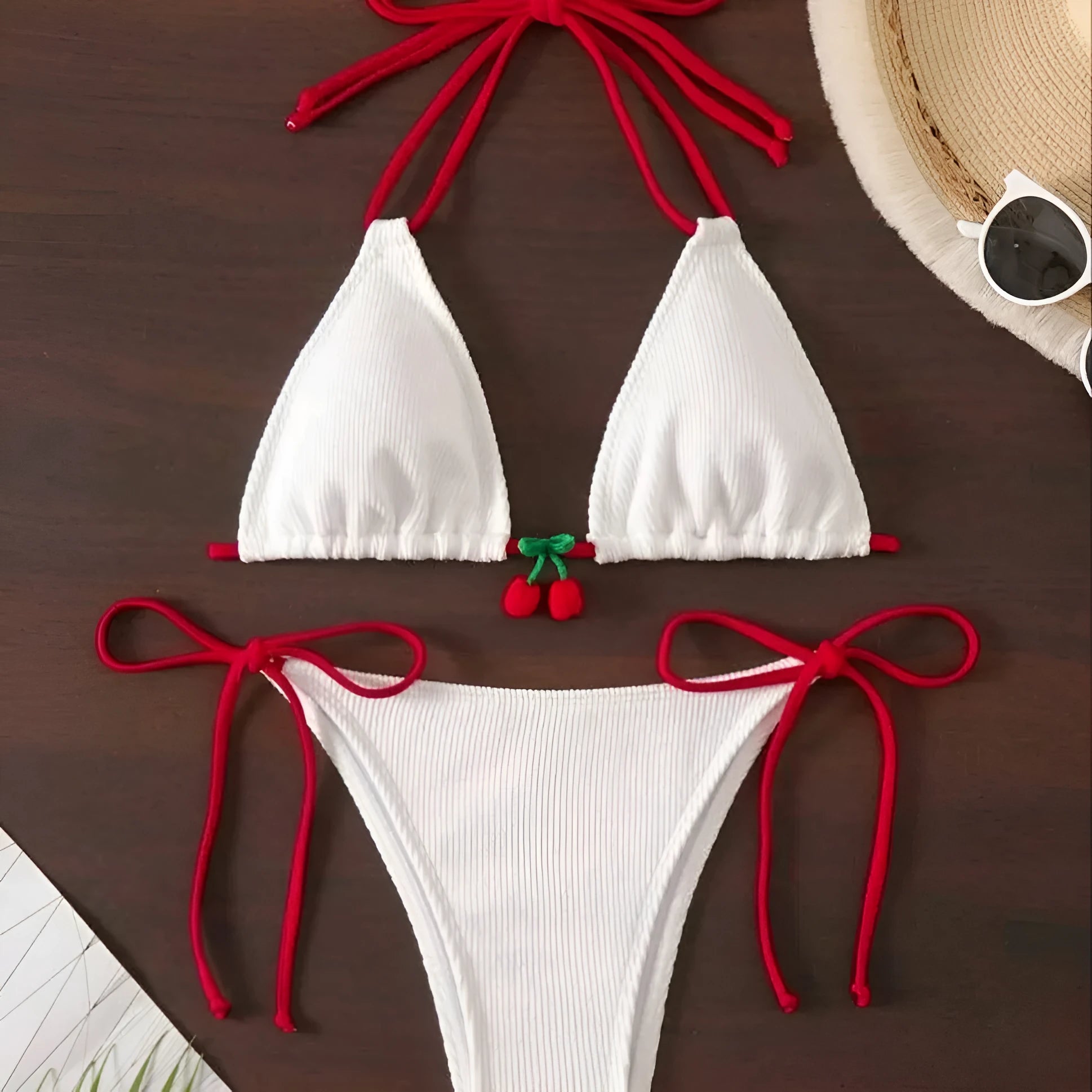 Solid colour briefs-style bikini swimsuit on a hanger, showing the top and pants.