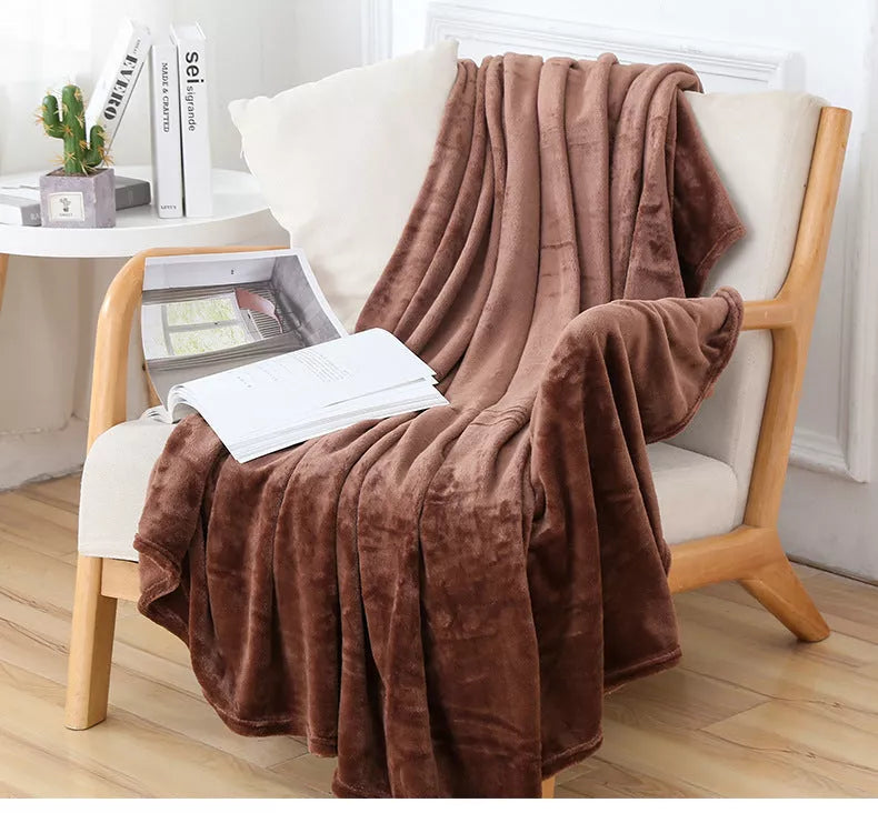 Solid color flannel blanket in various sizes and colors, made from durable polyester fiber
