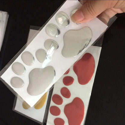 Pair of hand-shaped brush dog footprints PVC car sticker in black, gold, red, or silver colour.