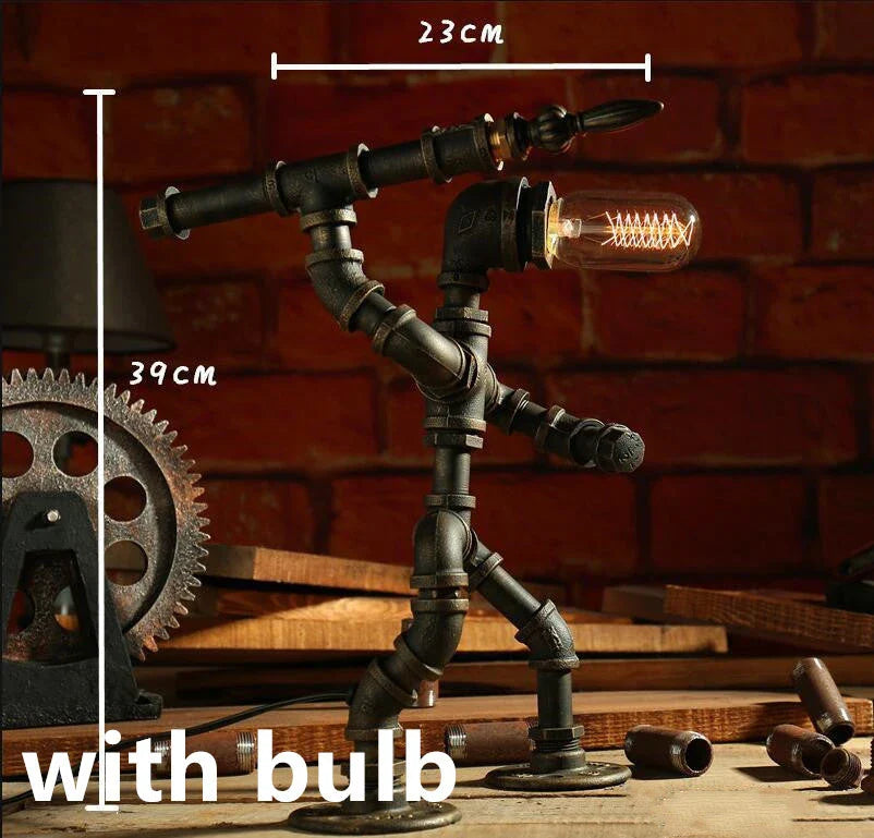 Vintage industrial iron pipe table lamp with soft, warm lighting and a green bronze finish