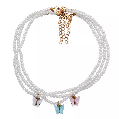 Elegant white pearl choker necklace with butterfly charm for women