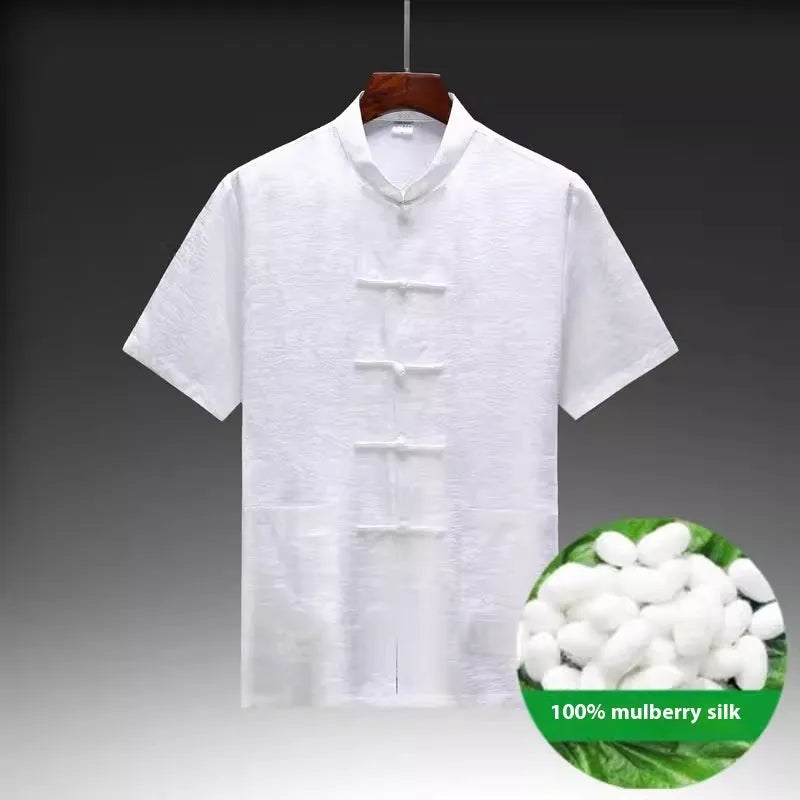 Traditional light green mulberry silk Tang suit for men on a hanger.