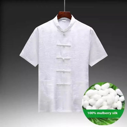 Traditional light green mulberry silk Tang suit for men on a hanger.