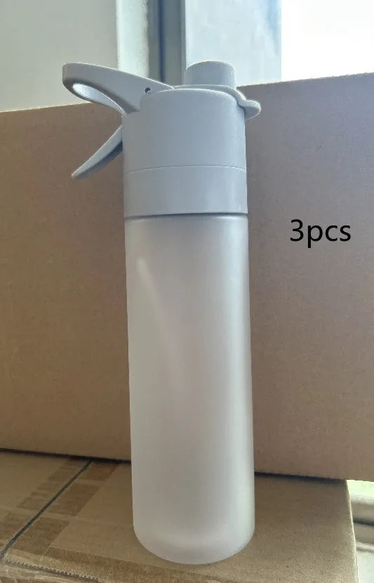 Large plastic spray water bottle with handle strap and leakproof lid in green colour.
