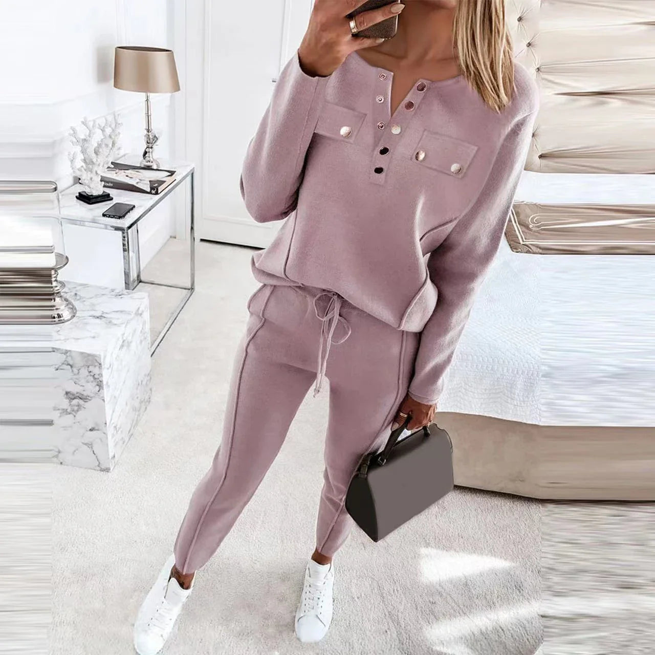 Cozy two-piece loungewear set with crew-neck sweater top and drawstring pants in pink, grey, and navy blue colors