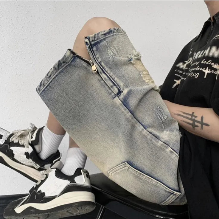Blue denim shorts with wide-leg cut and tattered retro detailing on mannequin