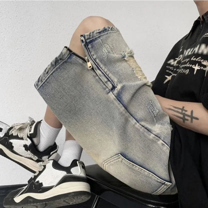 Blue denim shorts with wide-leg cut and tattered retro detailing on mannequin