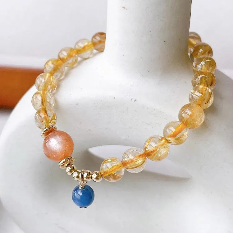 Gold rutilated quartz sunstone bracelet with round diamond shape and adjustable 20-24cm sizing