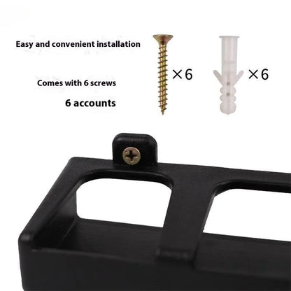 Black ABS wall-mounted fishing rod storage rack holding multiple rods horizontally on a shed wall.