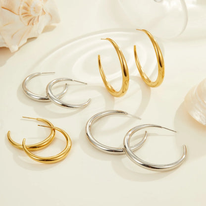 Women's stainless steel hoop earrings in two sizes with gold or steel finish
