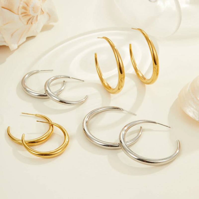 Women's titanium steel hoop earrings with 18K gold plating in two sizes and finishes, stainless steel construction with geometric round shape for fashion OL style, vacuum PVD furnace plated