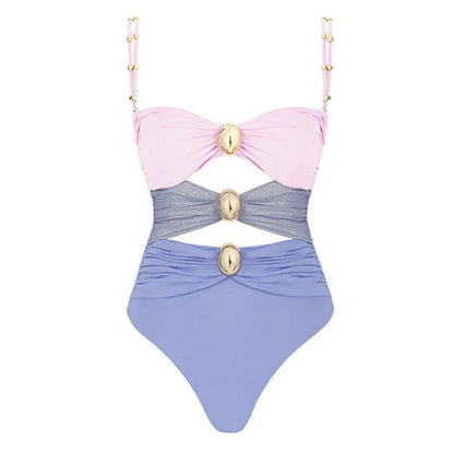 Women's green one-piece swimsuit with round buckle decoration and hollow-out stitching detail on nylon fabric.
