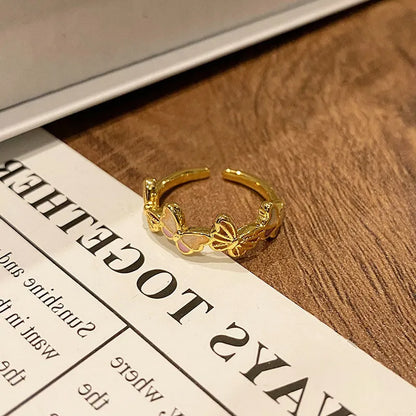 Copper women's ring with Chinese butterfly design and adjustable open loop.