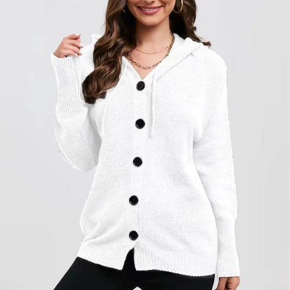 A woman wearing a loose, thick, hooded cotton cardigan in a solid colour.