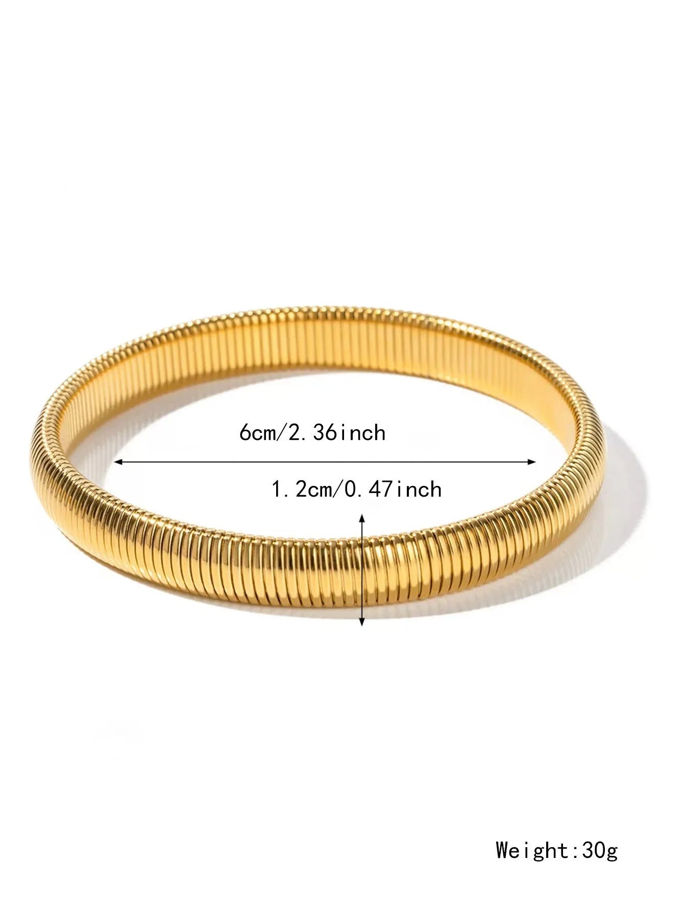 Women's titanium steel elastic bracelet with a vertical stripe pattern in gold, shown on a wrist.